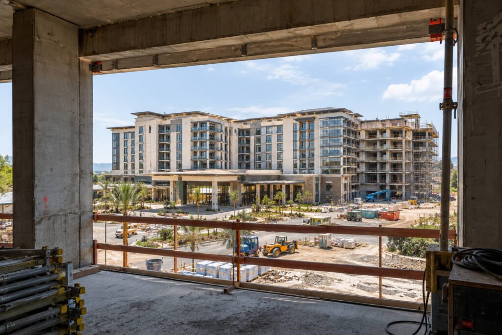 Hotel development viewed through unfinished structure